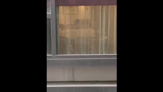 Lovers filmed by the window in voyeur while they fuck. Real tape
