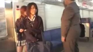 Japanese Schoolgirls Abuse old Fat Guy in Subway