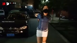 Woman Walks around outside in Armbinder