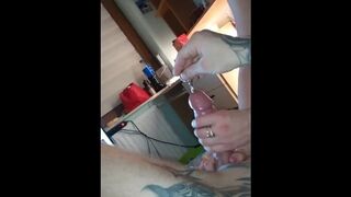 Domina Sounding his Cervix with Dilator